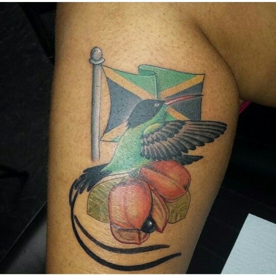 a tattoo with a bird and flag on it