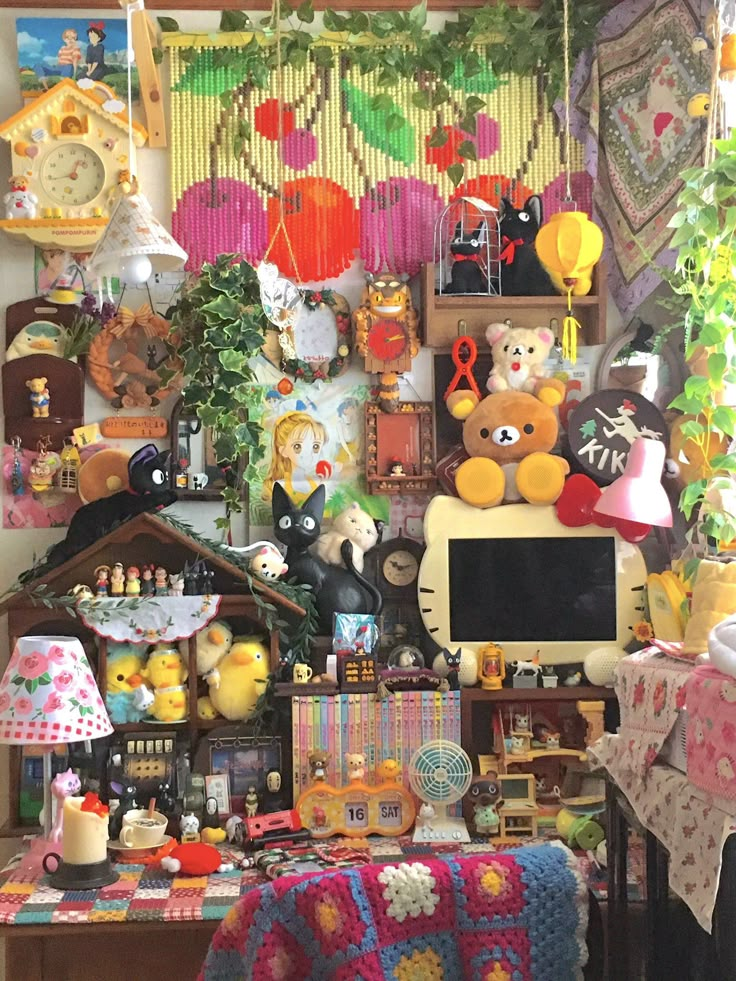 a room filled with lots of stuffed animals and other things on top of a table