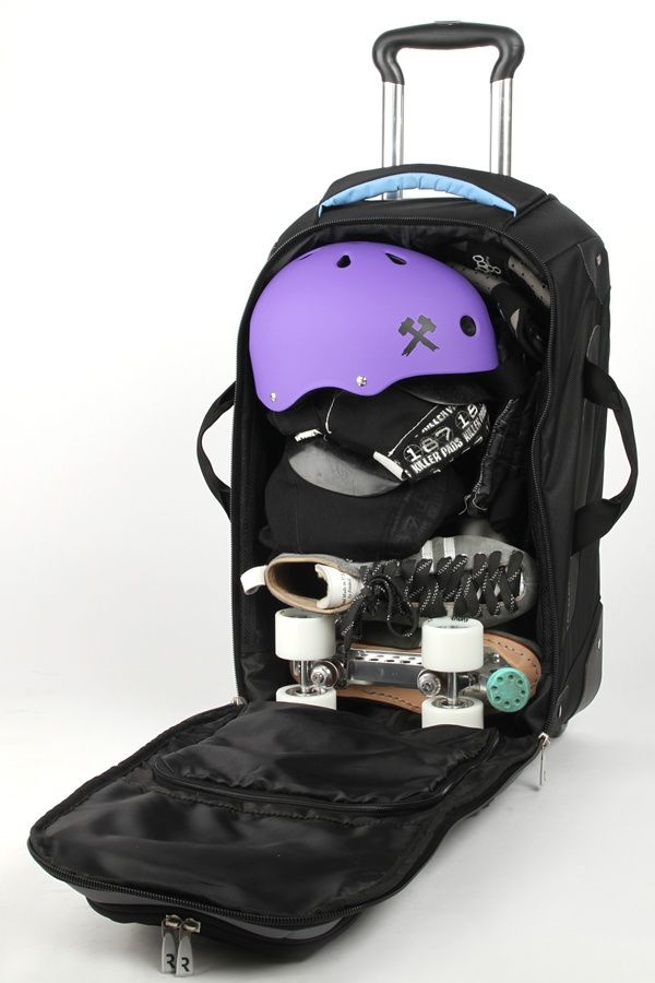 a purple helmet, skateboard and other items in a black backpack with wheels on white background