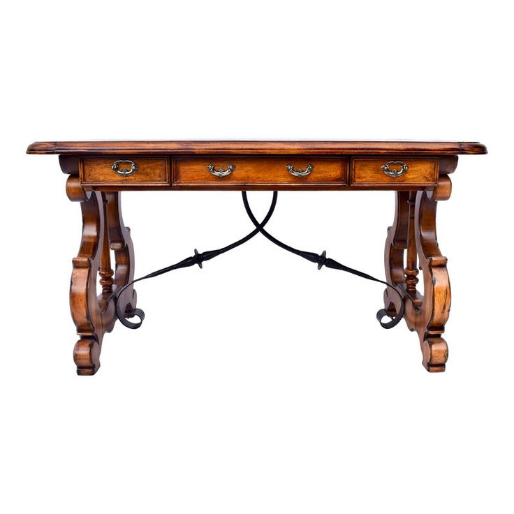 an old wooden table with two drawers on one side and wrought iron handles on the other