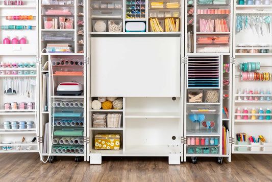 an organized closet with lots of craft supplies