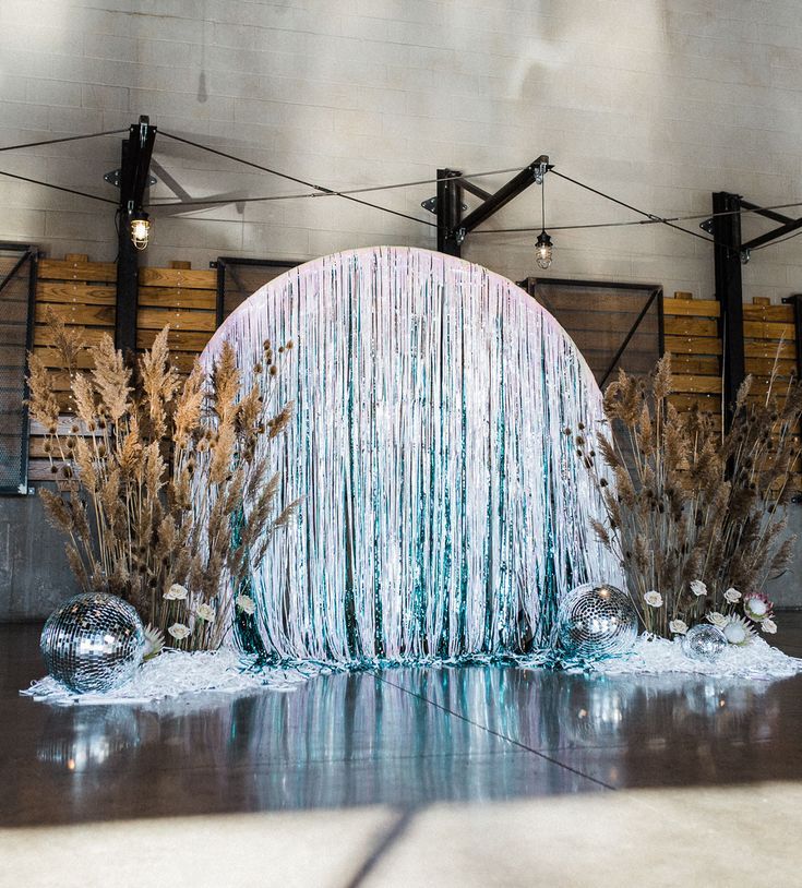 an ice sculpture in the middle of a building with water flowing down it's sides