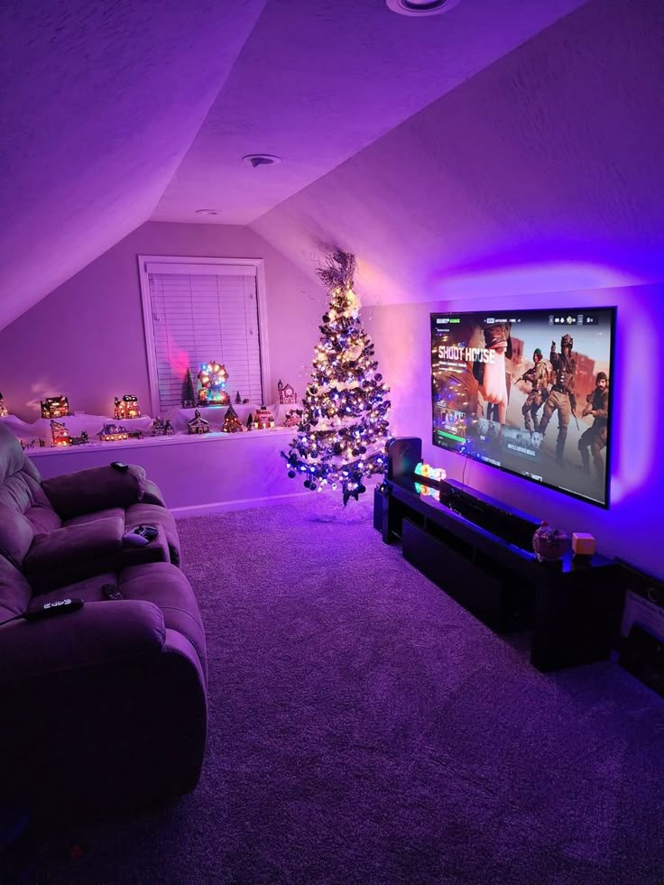 a living room with purple lighting and a christmas tree in the corner on the wall