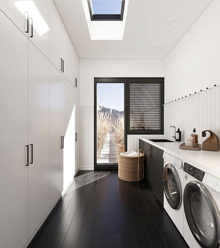 the laundry room is clean and ready to be used as a washer and dryer