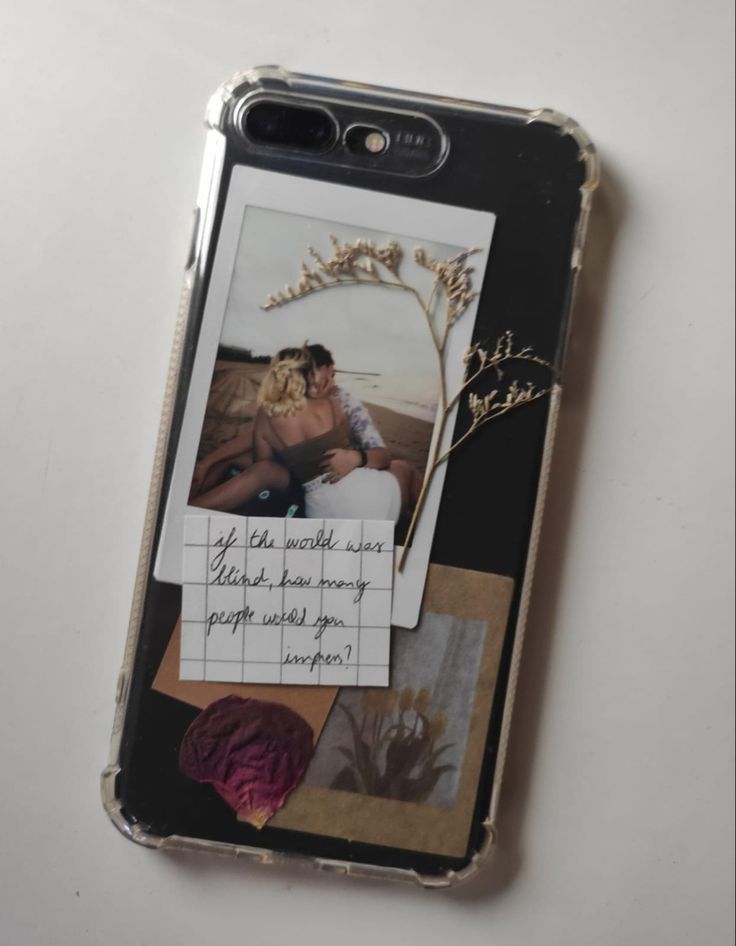 a cell phone case with an image of a man and woman on it, sitting next to each other