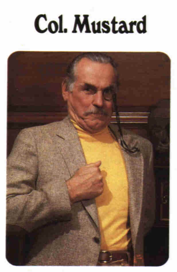 an older man wearing a yellow shirt and jacket