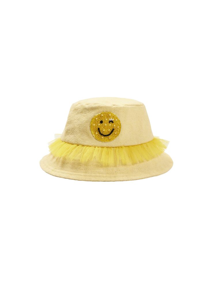 Spread joy and sunshine with our debut Smiley Hat! This delightful bucket hat, crafted from soft cotton canvas, features a playful tulle trim for an extra dash of fun. Showcasing an embellished smiley face motif on the front, designed to brighten her day and everyone around her. Perfect for sunny days or adding a bit of sparkle to everyday adventures. Smiley Hat, Everyday Adventures, Net Fabric, Pastel Yellow, Smiley Face, Cotton Weaving, Sunny Days, Smiley, Sunnies