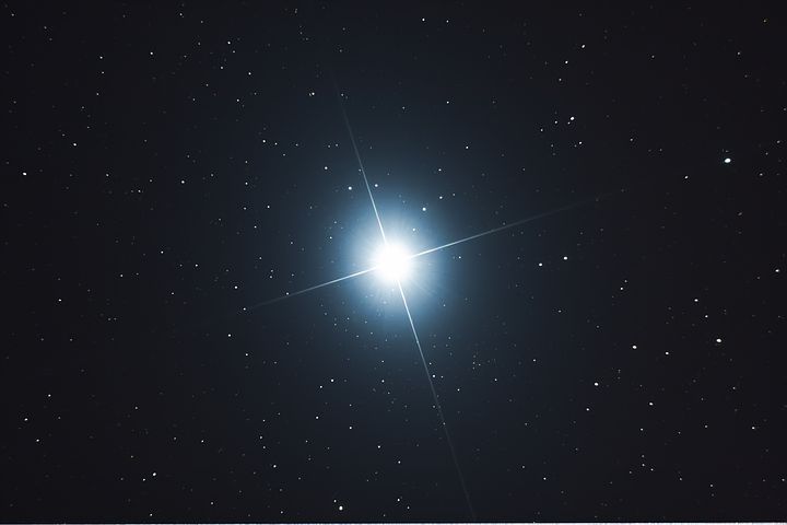 the bright star is shining brightly in the dark sky