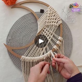 someone is working on an art project with yarn