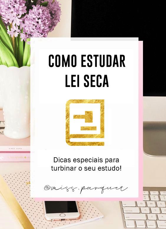 a sign that says como estuar lei seca next to a keyboard and flowers