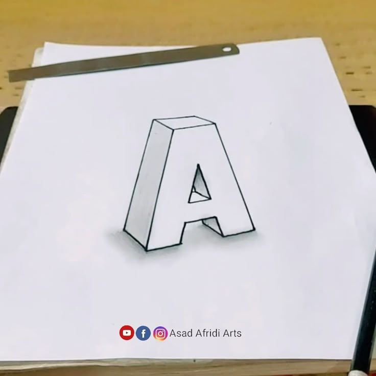 the letter a is drawn on top of a piece of paper with a pencil next to it