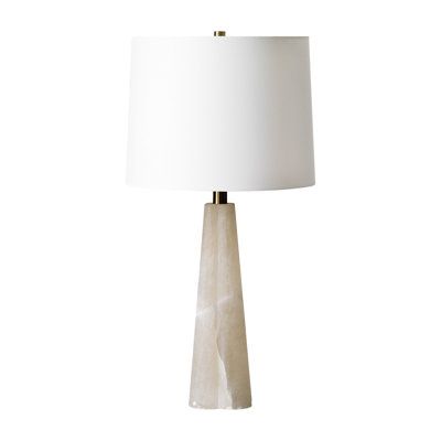 a table lamp with a white shade on it