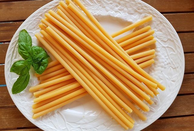 a white plate topped with lots of cheese sticks