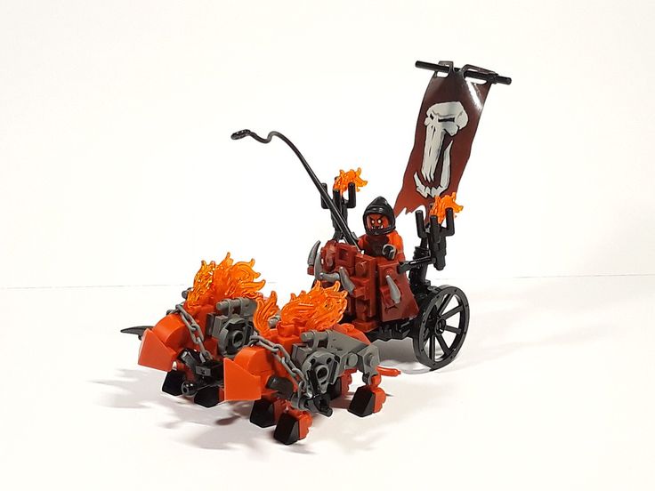 an orange and black toy bike with flames coming out of it