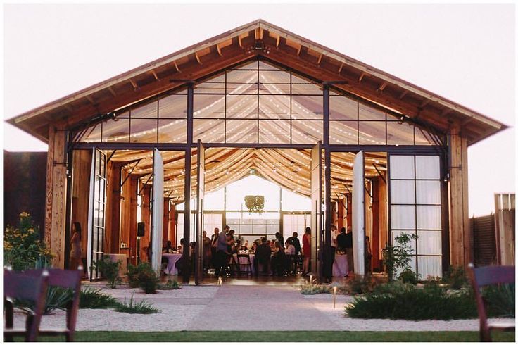 a group of people standing in front of a building