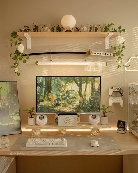 a desk with a computer, keyboard and various other items on it in front of a painting