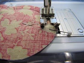 the sewing machine is working on the fabric