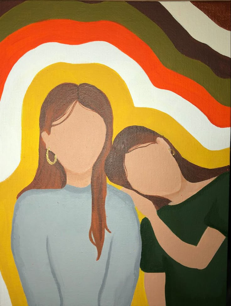 two women standing next to each other in front of a colorful painting on the wall