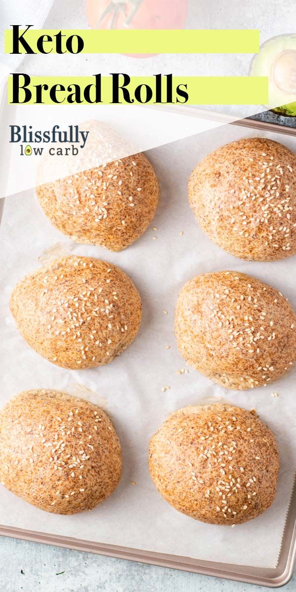 six bread rolls on a baking sheet with text overlay that reads keto bread rolls blissfully low carb