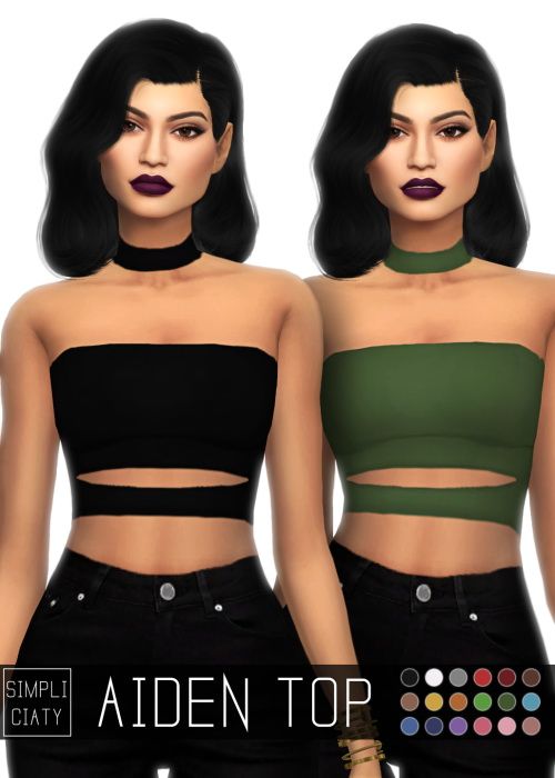 two women wearing crop tops and black pants