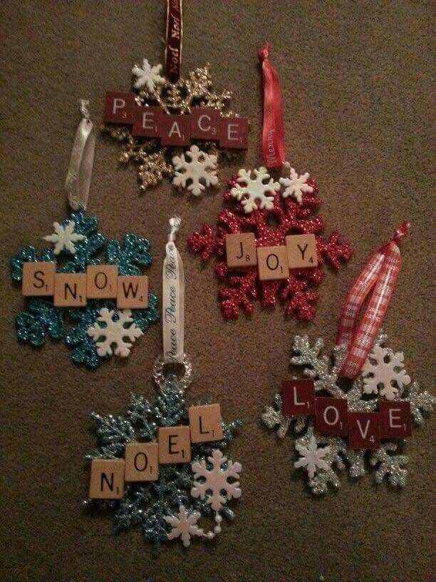 christmas ornaments made from scrabbles on the floor with words that spell out peace and joy