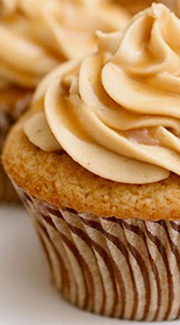 cupcakes with frosting sitting on top of each other