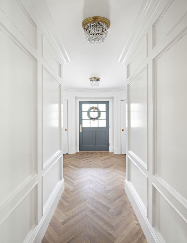 the instagram page on instagram shows an empty hallway with white walls and wood floors