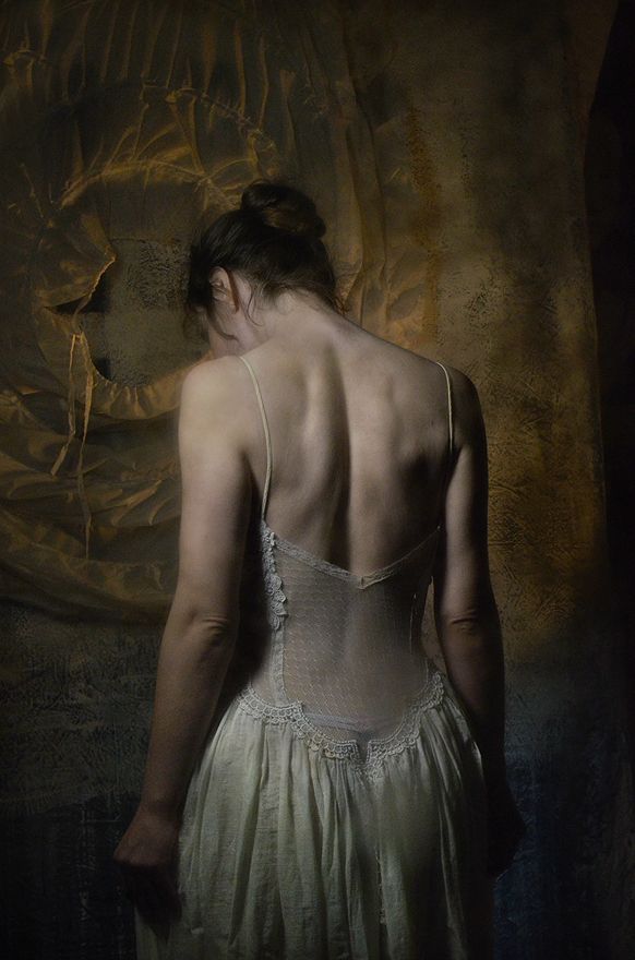 the back of a woman in a white dress