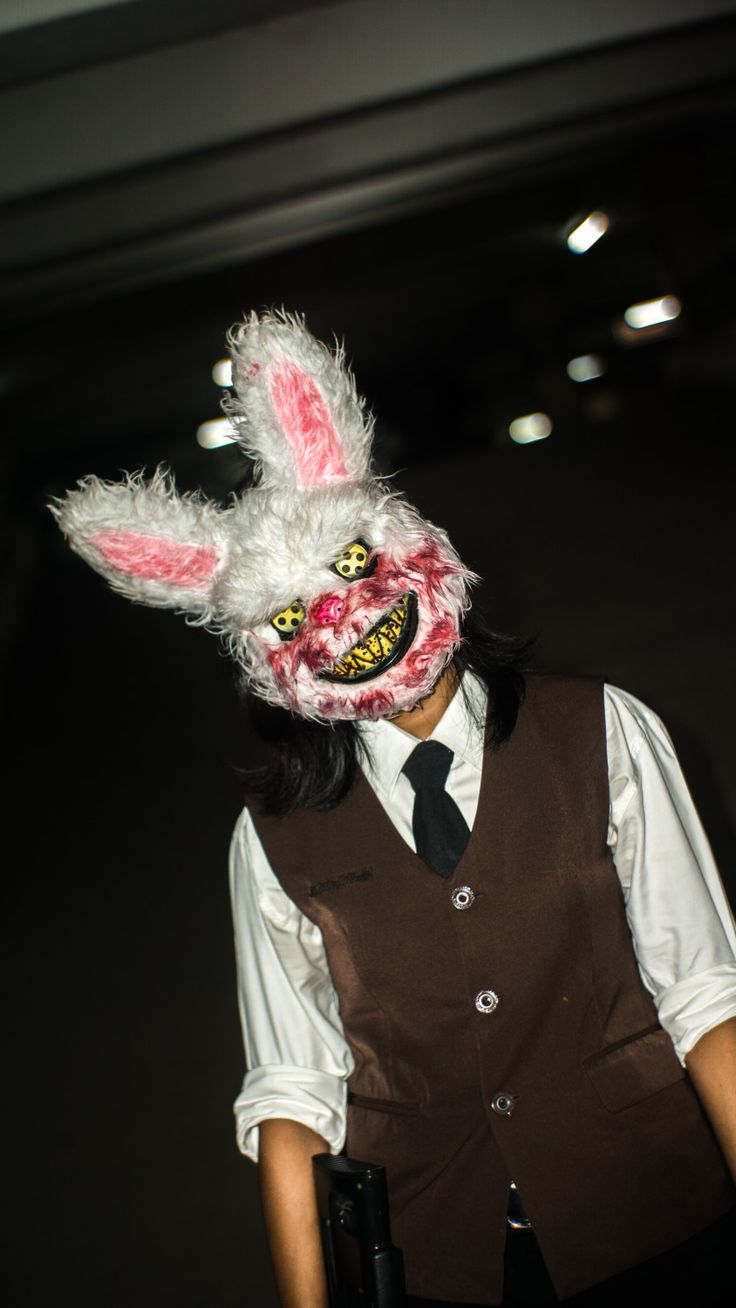 a person wearing a bunny mask and vest