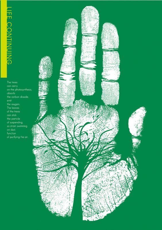 a green poster with a tree in the middle and an image of a hand on it