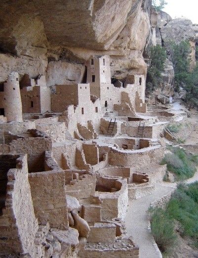 the cliff houses are built into the side of the mountain