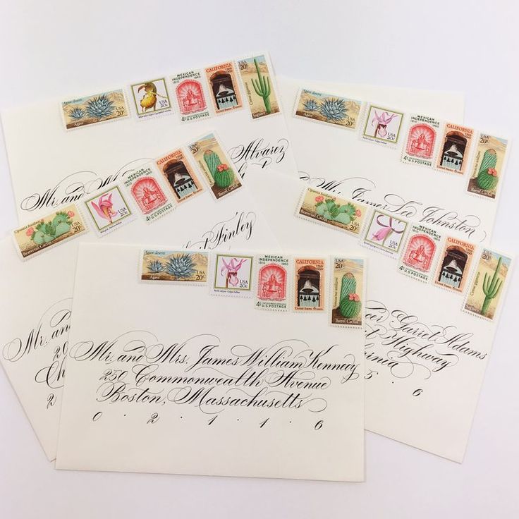 four envelopes with different stamps on them