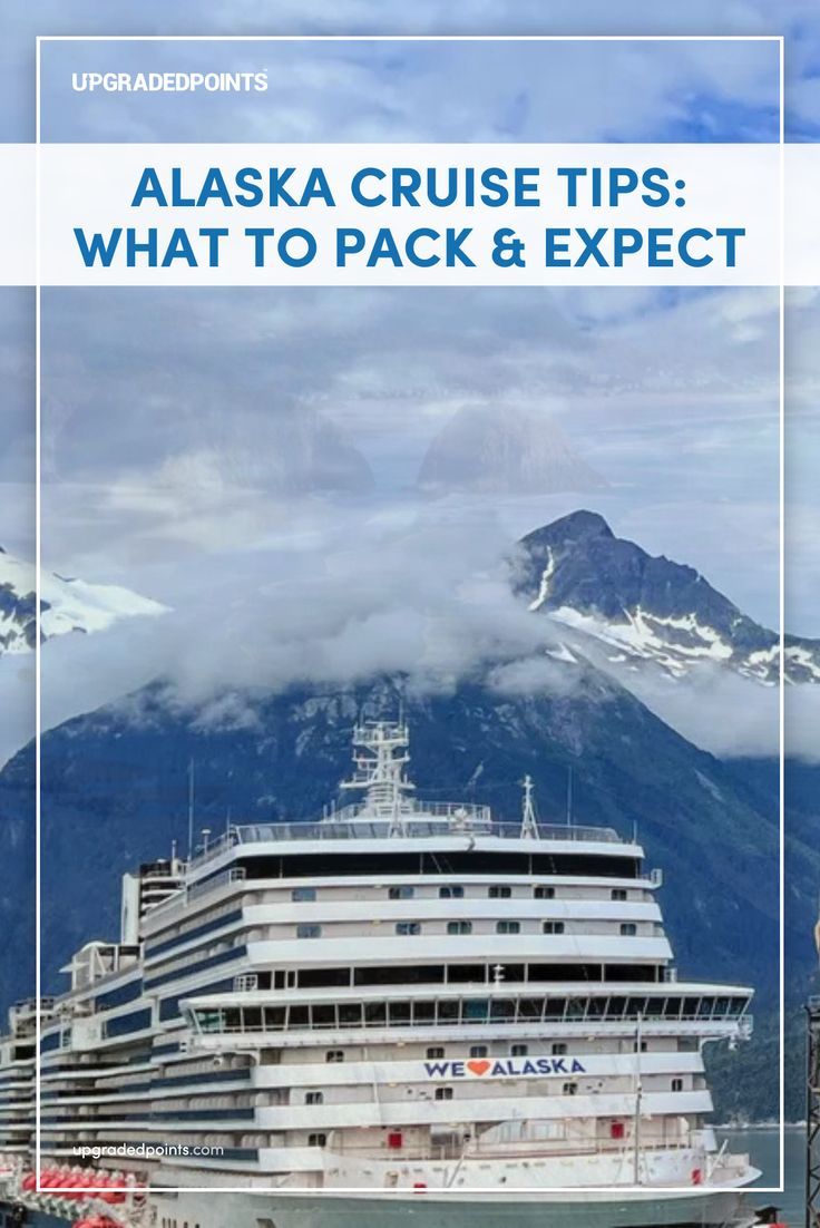 A docked cruise ship with a "We ❤️ Alaska" logo at an Alaskan port, framed by towering, cloud-covered mountains and a cloudy blue sky. An industrial structure and buildings are visible on the right. Cruise Tips And Tricks, Packing Tricks, Alaska Cruise Tips, Packing For A Cruise, Alaskan Cruise, Alaska Cruise, Cruise Tips, What To Pack, Packing Tips