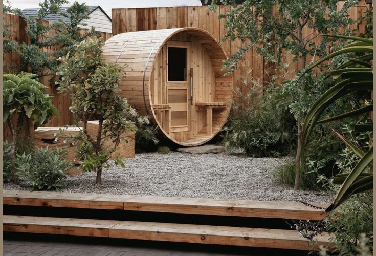 a wooden sauna in the middle of a garden