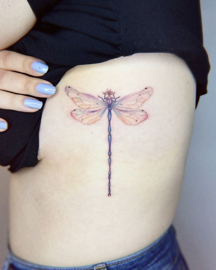 Vibrant Elegance: Colorful Dragonfly Tattoo by Demet Eken Colorful Dragonfly Tattoo, Tattoo Location Ideas, Infinity Tattoo With Feather, Thistle Tattoo, Thumb Tattoos, Around Arm Tattoo, Birthday Tattoo, Insect Tattoo, Colorful Dragonfly