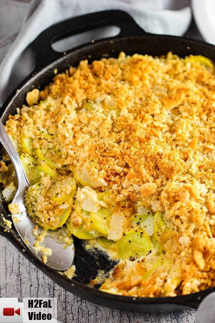 a casserole dish with broccoli and bread crumbs