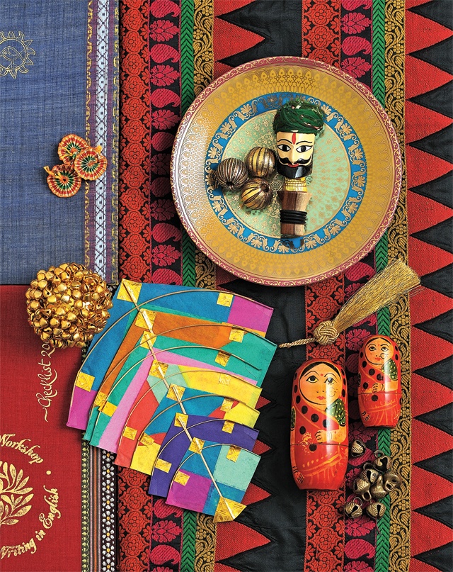 an assortment of decorative items displayed on colorful cloth