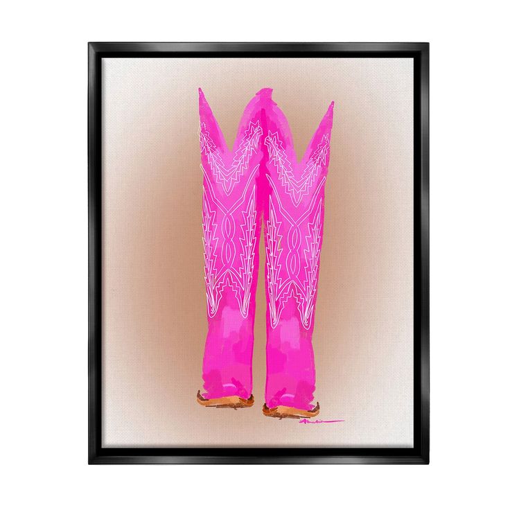 a pair of pink cowboy boots sitting on top of a table