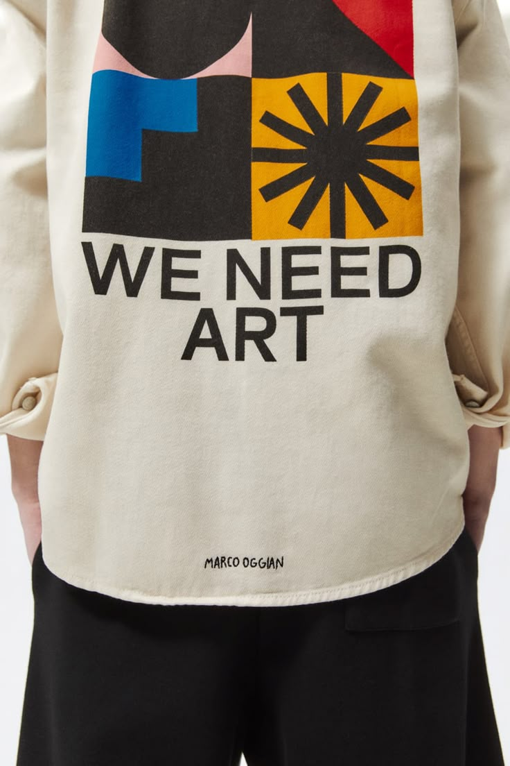 the back of a man's jacket that says we need art