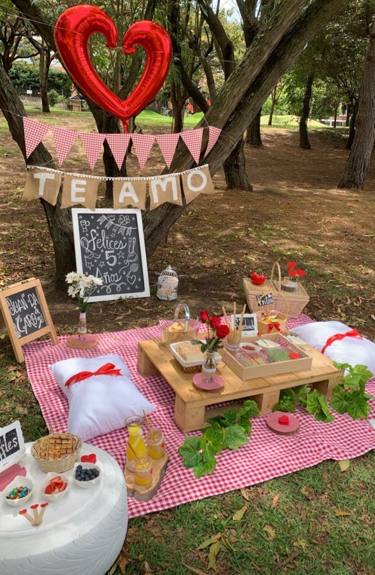 an outdoor picnic with food and decorations