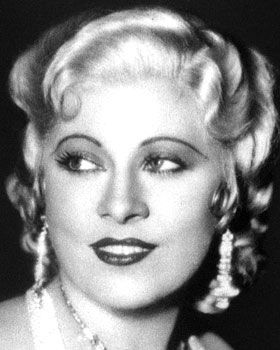 an old black and white photo of a woman with blonde hair, wearing large earrings