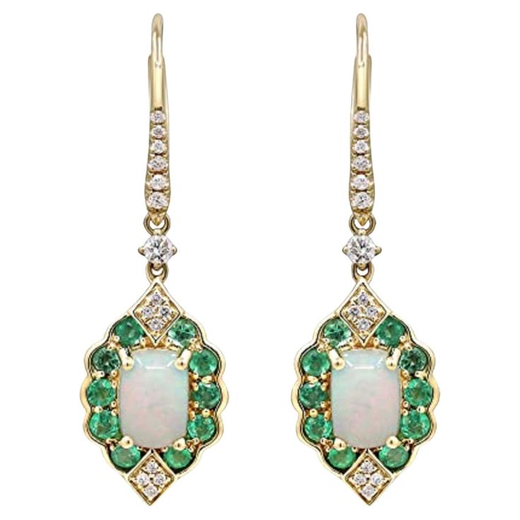 Decorate yourself in elegance with this Earring is crafted from 14-karat Yellow Gold by Gin & Grace. This Earring is made up of 5*7 Cushion-cut Ethiopian opal (2 Pcs) 1.30 carat, 2.0 round-cut Emerald (20 pcs) 0.61 grams and Round-cut White Diamond (30 Pcs) 0.20 Carat. This Earring is weight 4.02 grams. This delicate Earring is polished to a high finish shine. Ethiopian Art, Emerald Earrings, Delicate Earrings, Jewelry Earrings Hoops, Cushion Cut, Ethiopian Opal, White Diamond, Gin, Round Cut