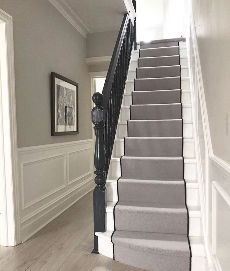 the stairs in this house are painted gray and white