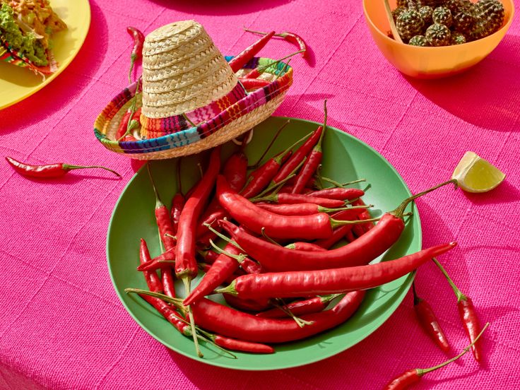 there are many different types of food on the table, including carrots and peppers