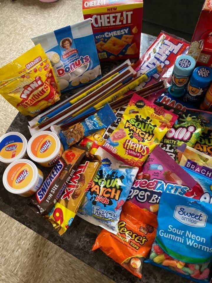 a table topped with lots of candy and snacks