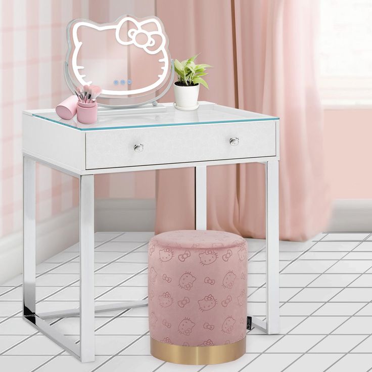 a hello kitty vanity table with a mirror and potted plant on the top shelf