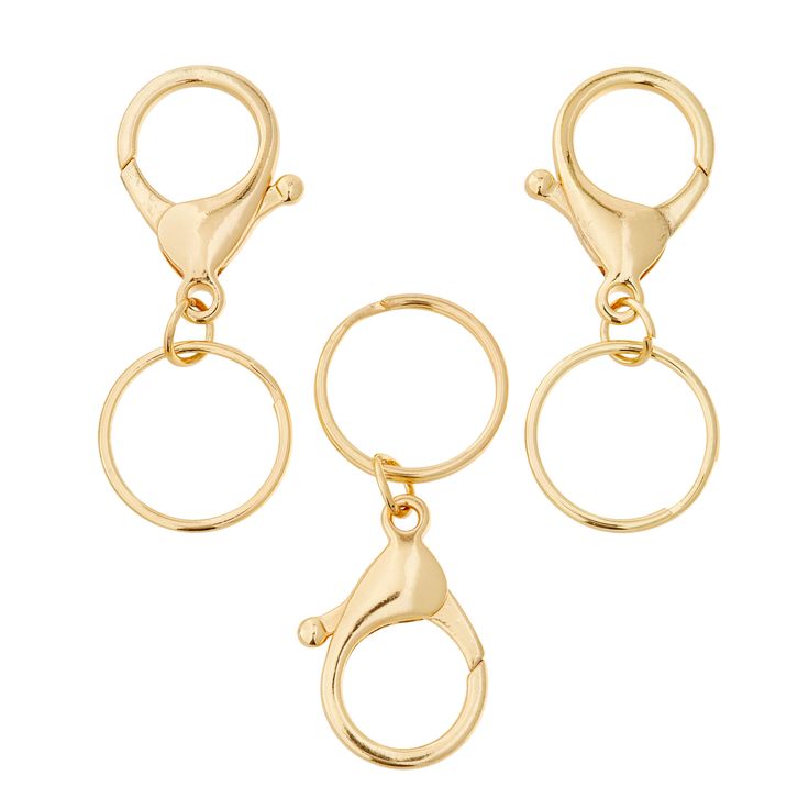 three pairs of gold tone metal rings with two loops on each end and one loop at the top