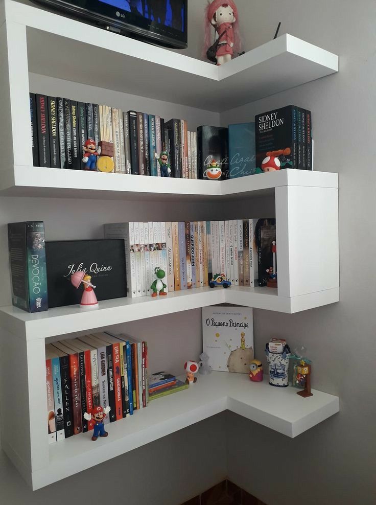 a corner book shelf with several books on it