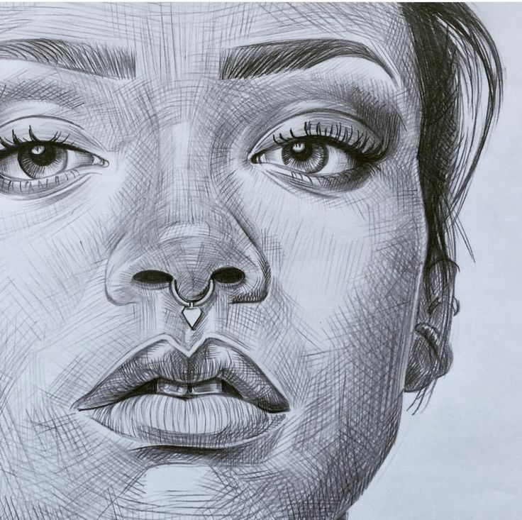 a pencil drawing of a woman's face with the nose ring on her nose