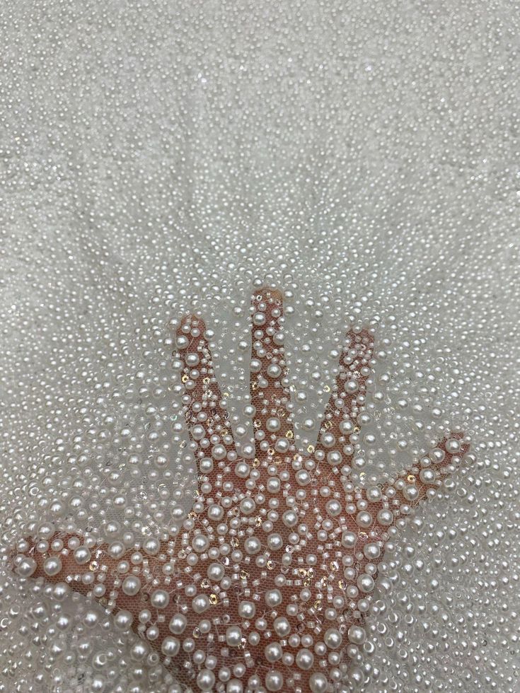 a brown and white starfish with lots of bubbles on it